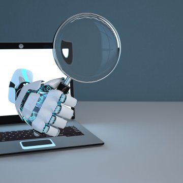 advanced system repair system optimizer hand coming out of laptop monitor holding magnifying glass 